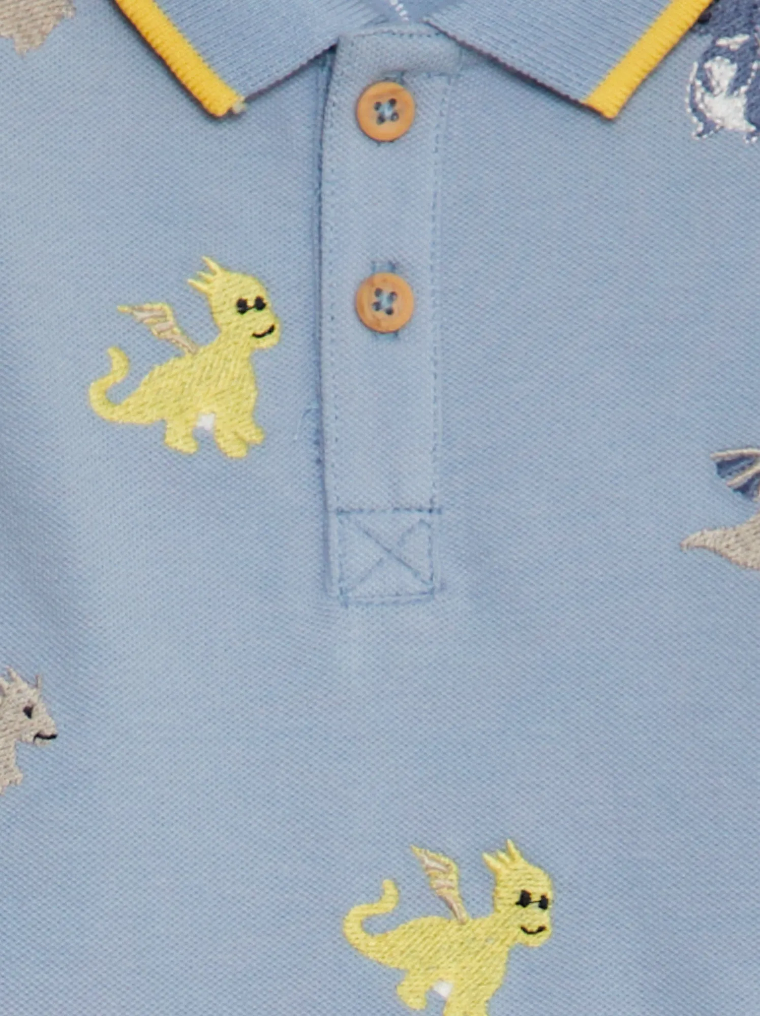 Polo con ricami dinosauro 'NAME IT' - blu