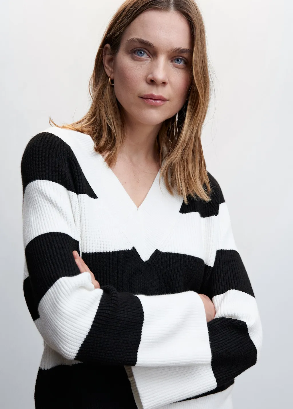 Pullover righe collo a V